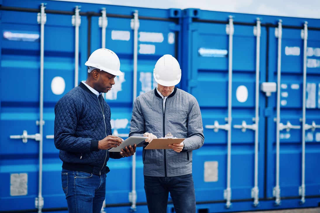 Two Engineers Tracking Containers in a Freigh Yard