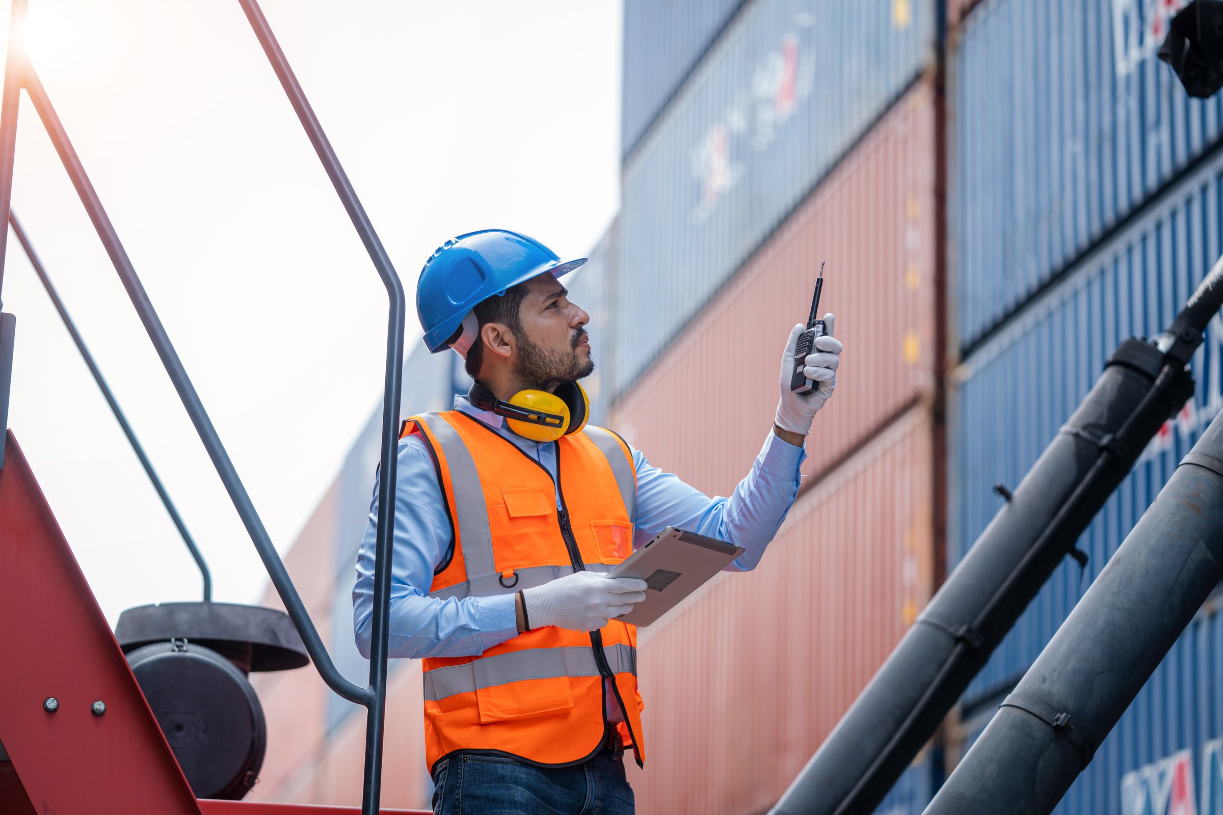 Container yard worker checking container at container yard wareh